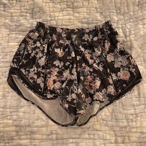 Lululemon hotty hot shorts, black with floral graphic, size 6